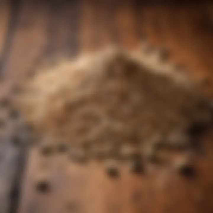 Dried coriander seeds spread out on a wooden surface