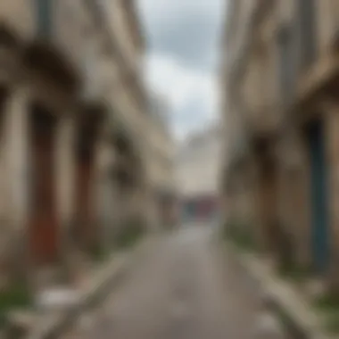 A narrow street in a Parisian slum showcasing dilapidated buildings