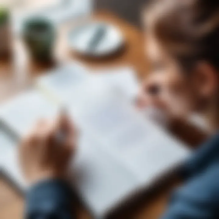 A focused individual writing down goals in a journal