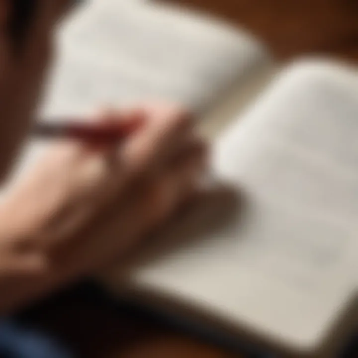 A close-up of a person writing in a journal